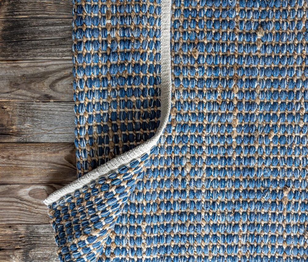 hand-woven-geometric-denim-area-rug-jute-braided-home-background-texture_169016-47066